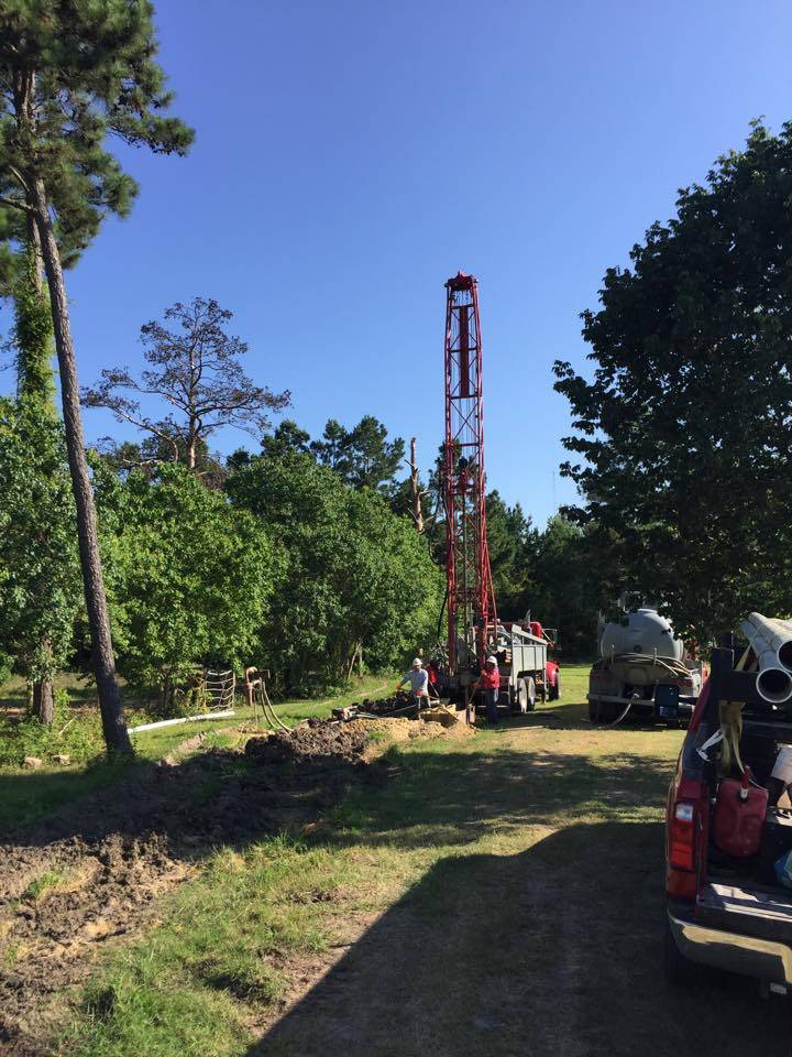 Holly Water Wells drilling rig set up for a residential water well drilling job
